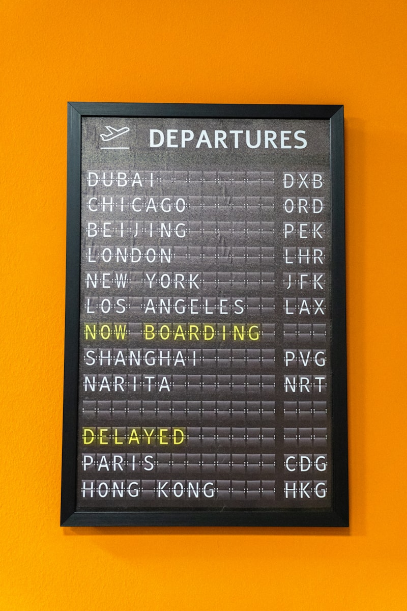 Airport departures board displaying flight information
