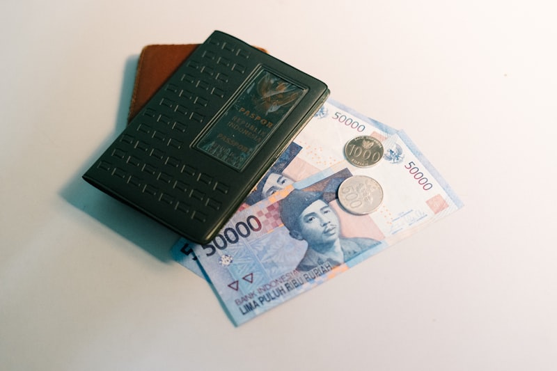Indian rupee notes and a passport on a desk